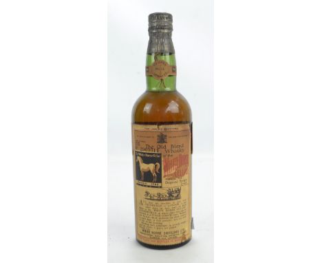 A White Horse 'Very Old' Pure Blended Scotch Whisky, with label stating bottling date of 1939 and no.2969811, lacking carton.