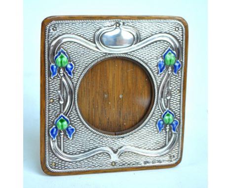 A & J ZIMMERMAN LTD; an Edward VII hallmarked silver fronted Art Nouveau photo frame embossed and green and blue enamel detai