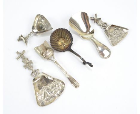 A group of six Dutch silver caddy spoons/scoops, three with embossed decoration to the bowls and one with Cupid mounted handl