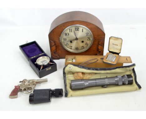 A small mixed lot of collectors' items including a Russian monocular with certificate, a 1930s oak mantel clock, a toy pistol