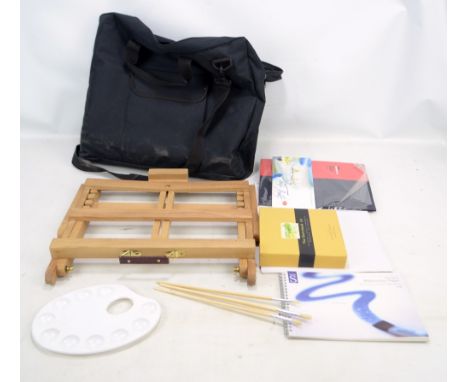 A modern canvas holdall containing a travel easel. 