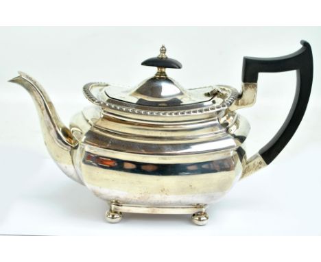 WALKER & HALL; a George VI hallmarked silver teapot of shaped rectangular form with cast decorated rim, on four bun feet, She