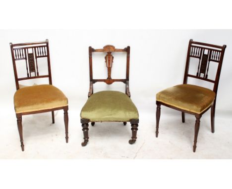 ASHWORTH OF MANCHESTER; a pair of Edwardian mahogany side chairs with padded stuff-over seats and turned front legs, both wit