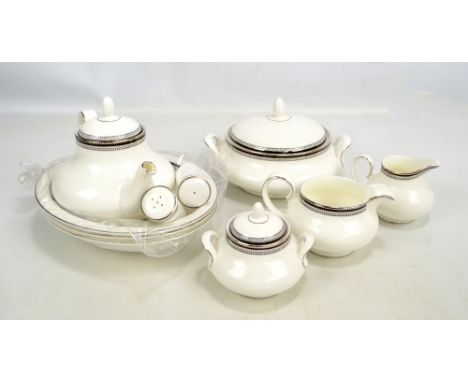 A Royal Doulton 'Sarabande' pattern twelve setting dinner and tea set comprising cups and saucers, dessert bowls, dinner plat