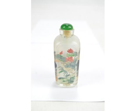 A Chinese inside painted glass snuff bottle of square tapering form depicting figural garden scene in mountainous landscape a