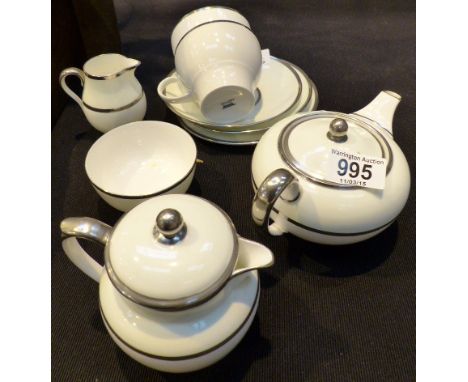 Wedgwood part tea set, white with platinum band, Teapot. hot water jug, milk sugar cup and saucer and side plate.