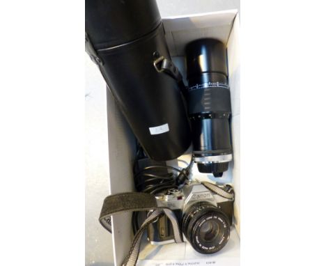 Canon AV-1 camera with 50mm lens and Sigma 1:56 300mm lens