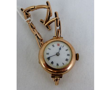 1920's 9 ct gold mechanical ladies watch on expanding yellow metal bracelet.