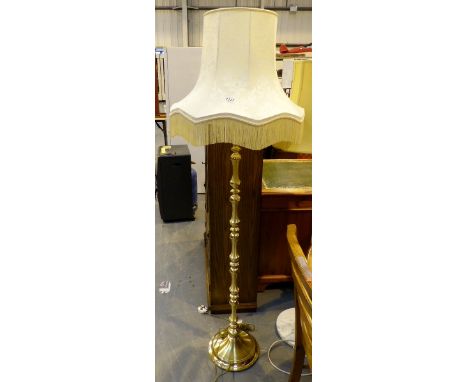 Brass standard lamp and shade.