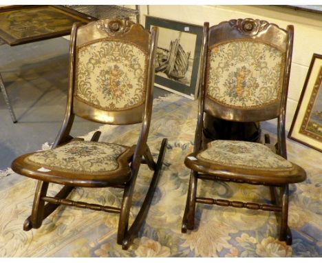 Pair of folding wooden rocking chairs with tapestry seats