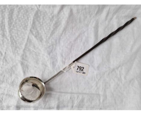 A George III toddy ladle with bright cut whalebone handle, 14" long