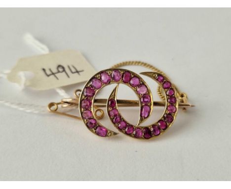 A antique gold and ruby double crescent brooch 3.7 gms