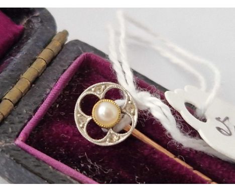 A boxed gold stick pin with pearl and diamond terminal