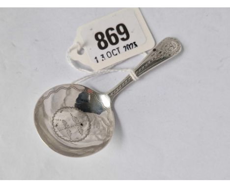 A Georgian caddy spoon with engraved decoration, London 1791 by GB