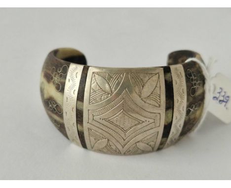 A horn and silver cuff bangle