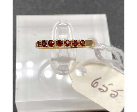 A ruby half hoop ring 14ct gold size N 1.7 gms