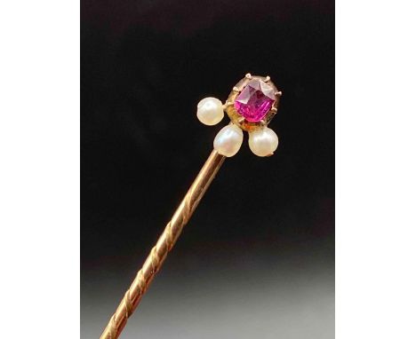 A vintage ruby and real pearl stick pin 15ct gold