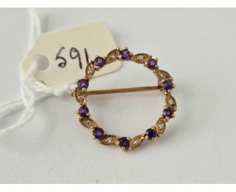 A circular amethyst and diamond brooch 9ct 2.8 gms