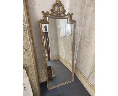 A gilt framed mirror of Chippendale design, 5ft.6inch by 2ft