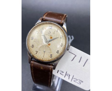 A gents stainless steel OMEGA wrist watch engraved 1955 to reverse with seconds sweep and leather strap W/O