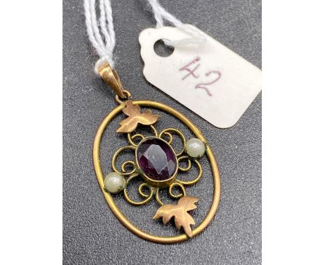 A Victorian amethyst and pearl decorated gold pendant