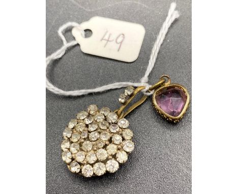 A amethyst heart pendant together with another gem stone set pendant
