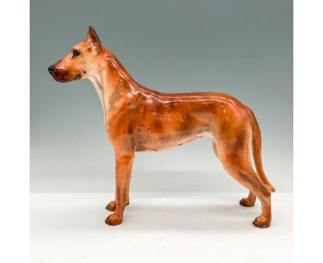 Tall, muscular body with light brown coat and erect ears. Royal Doulton backstamp. Issued: 1941 - 1955Dimensions: 9.25"L x 2.