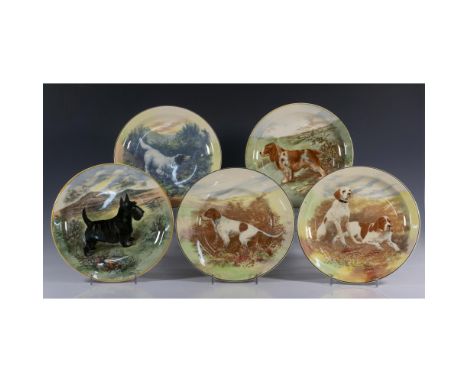 Stoneware plates designed with dog motifs in center. Set includes 2 Springer Spaniel plates D6353, Hunting Dog D5770, Scottis