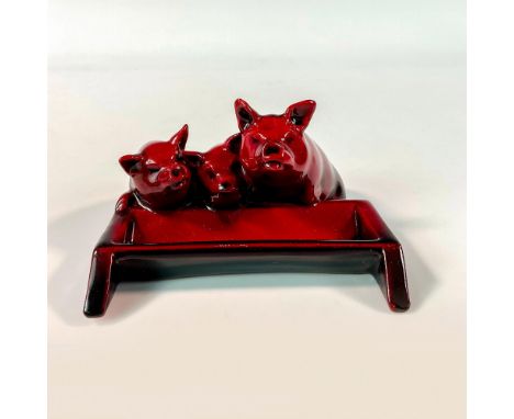 Rich red glaze modeled as three pigs at a water trough. Royal Doulton backstamp. Issued: c. 1931-1936Dimensions: 4"L x 3.5"W 