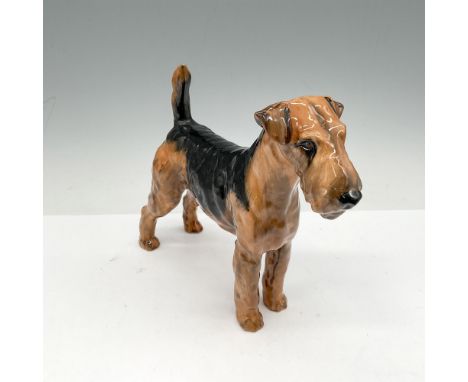 Cotsford Topsail is colored in natural dark brown and black coat with a light brown underbody. Royal Doulton backstamp. Artis