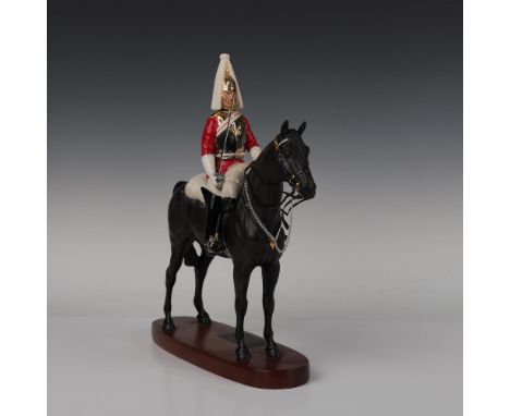 Part of the Connoisseur Horses series, style two with a sword. A matte finish of a guard of the British Army on a black horse