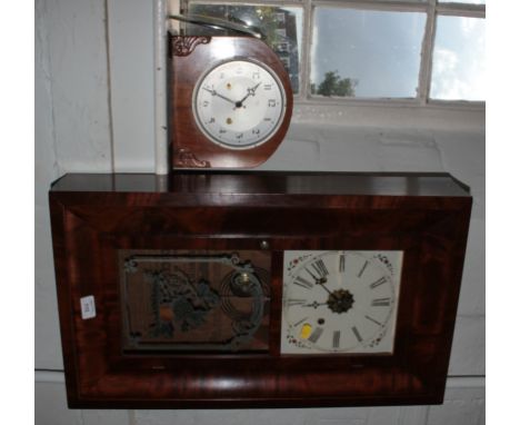 A 1920's walnut cased mantel clock, with foliate carved corners, the silvered dial enclosing a twin train Perivale movement, 