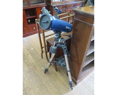 A Meade Instruments astronomical telescope, on a tripod base