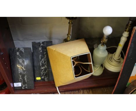 A pair of marble triangular bookends (chipped) 20cm high, a brass table lamp and two other table lamps