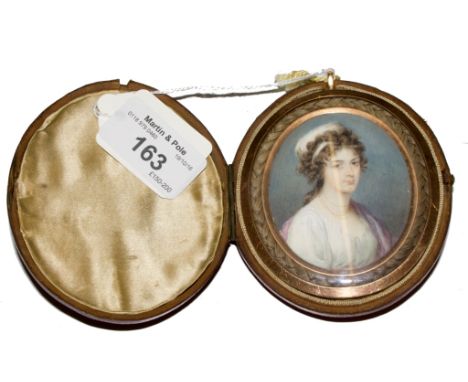 Early 19th century English School Portrait miniature on ivory of an unknown lady, in a yellow metal framed case with a border