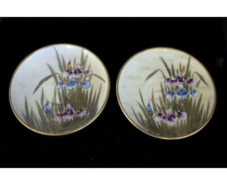 A pair of Satsuma miniature saucers depicting irises, 7cm diameter