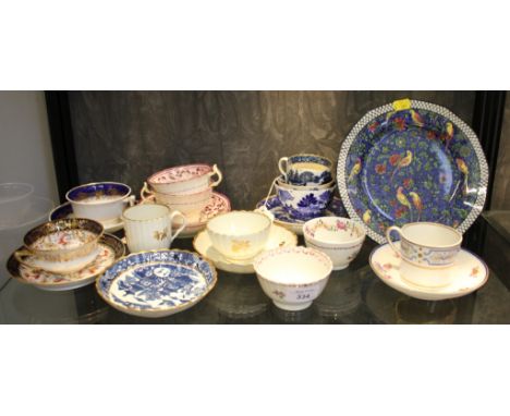 A collection of 19th century tea cups and saucers, including Coalport, Caughley, Worcester and a Royal Doulton plate