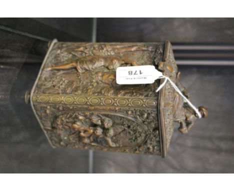 A bronzed brass tea caddy, early 20th century, of rectangular form, the hinged lid surmounted by Turk, the sides depicting al