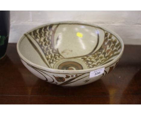 A stoneware art pottery bowl, in the style of Bernard Leach, impressed marks to foot rim, 32cm diameter