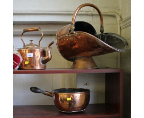 A copper coal scuttle, copper kettle, copper pan and a giltwood wall mirror (4)
