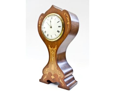 An Edwardian Art Nouveau style mahogany and inlaid mantel timepiece, of shaped waisted form with enamel dial and drum movemen