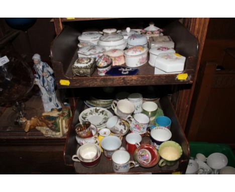 A collection of various cabinet cups and saucers and china dressing table boxes 