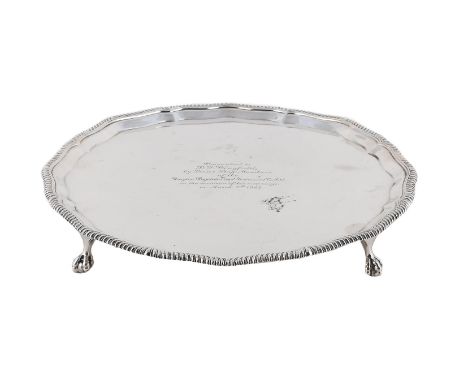 
	
		A SILVER SHAPED CIRCULAR SALVER
		GOLDSMITHS &amp; SILVERSMITHS CO. LTD., LONDON 1928
		With a gadrooned border, engrave