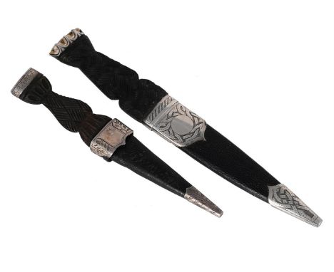 
	
		A SCOTTISH SILVER MOUNTED SGIAN DUBH
		THOMAS KERR EBBUTT, EDINBURGH 1962
		The silver mounted engraved with strapwork a