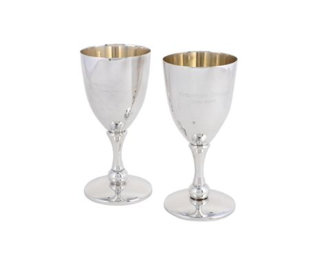 
	
		A PAIR OF SILVER GOBLETS
		JOHN BULL LTD., SHEFFIELD 2005
		Engraved Brandon Green May 2005, with waisted stems and on c