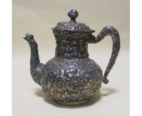 A white metal floral embossed teapot and two Masonic medals 