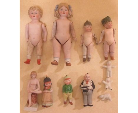 A group of bisque dolls and three 'snow babies' 