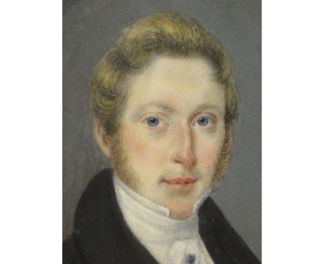 A collection of four portrait miniatures, one of a Gentleman wearing blue velvet coat with a high white collar and tied stock