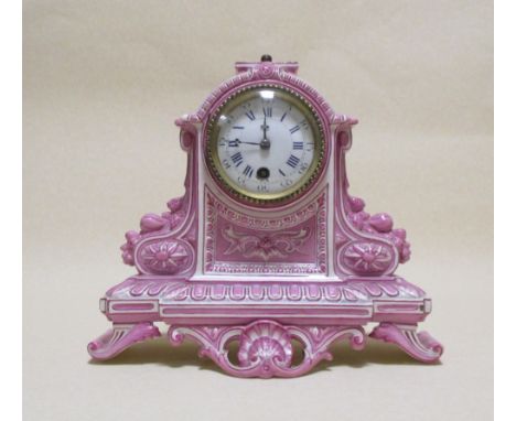 A 'Gien' porcelain cased mantel clock in pink and cream, with enamel dial and blue numerals (lacks pendulum) 