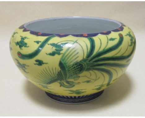 A Chinese yellow ground planter and a bowl and cover decorated with seal marks (2) 